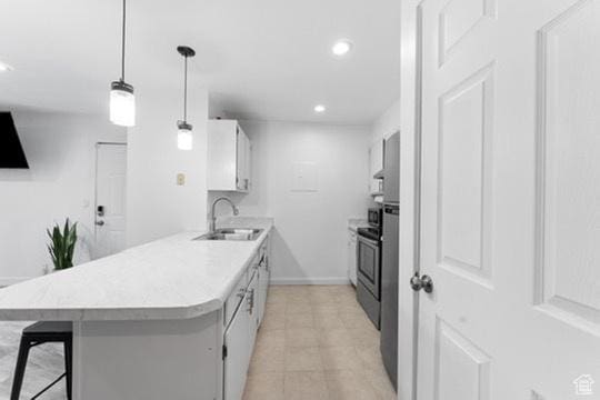 1196 E Waterside Cv S Unit 11, Cottonwood Heights, UT 84047 - kitchen with light countertops, recessed lighting, a breakfast bar area, white cabinetry, and a peninsula