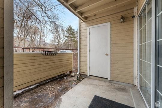 1196 E Waterside Cv S Unit 11, Cottonwood Heights, UT 84047 - view of exterior entry featuring a patio area