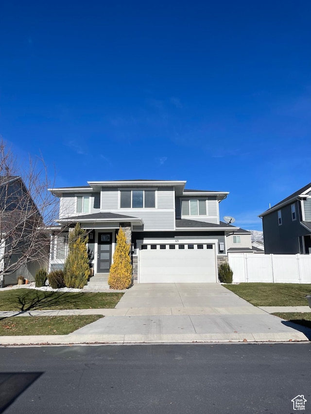 63 E Rose Way, Vineyard, UT 84059 - prairie-style house with driveway, an attached garage, and stone siding
