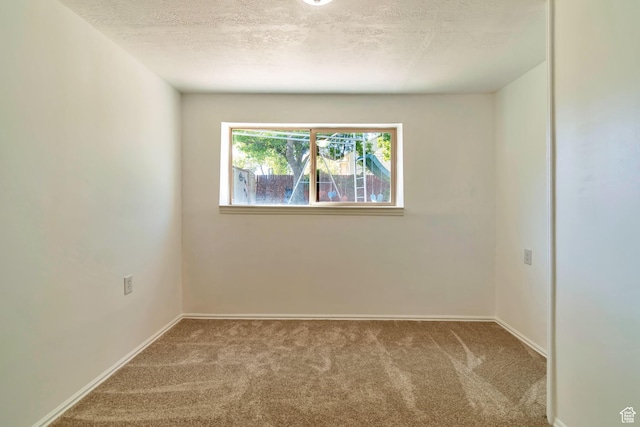 1241 W 4505 S, Taylorsville, UT 84123 - unfurnished room with carpet flooring and a textured ceiling