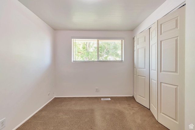 1241 W 4505 S, Taylorsville, UT 84123 - unfurnished bedroom with carpet floors and a closet