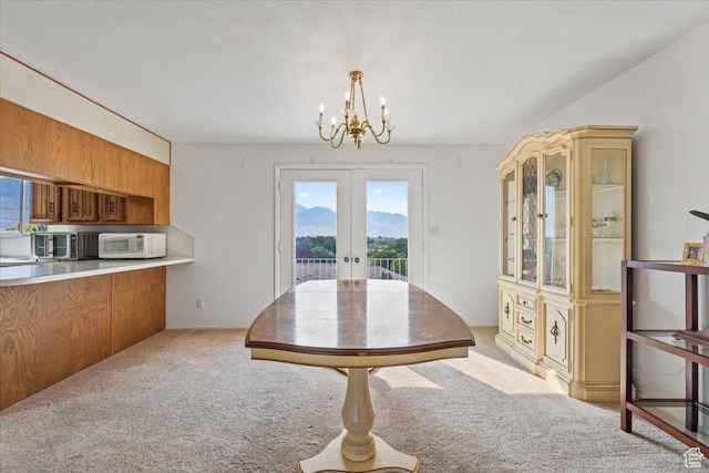 1252 N 100 E, American Fork, UT 84003 - dining area featuring a chandelier, light colored carpet, and french doors