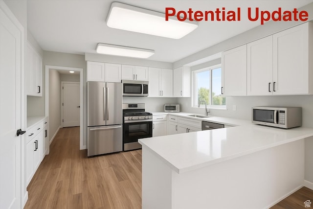 1252 N 100 E, American Fork, UT 84003 - kitchen featuring stainless steel appliances, a peninsula, light wood finished floors, light countertops, and white cabinetry