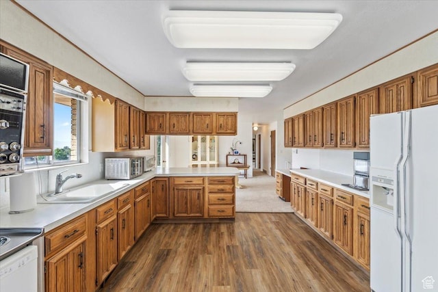 1252 N 100 E, American Fork, UT 84003 - kitchen featuring white fridge with ice dispenser, dark wood-style flooring, a peninsula, light countertops, and brown cabinets