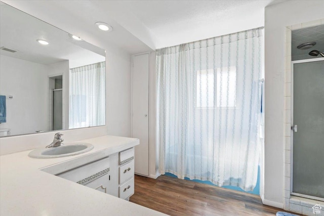 1252 N 100 E, American Fork, UT 84003 - bathroom featuring a stall shower, vanity, wood finished floors, and recessed lighting