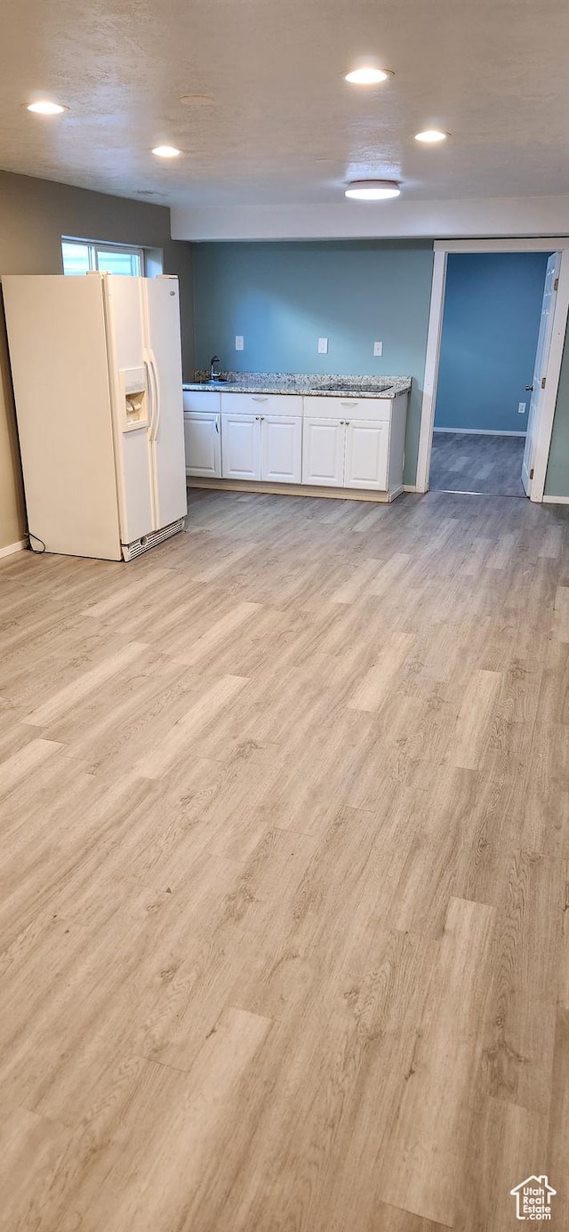 747 W 1580 N, Clinton, UT 84015 - kitchen featuring white refrigerator with ice dispenser, white cabinetry, light wood finished floors, and recessed lighting
