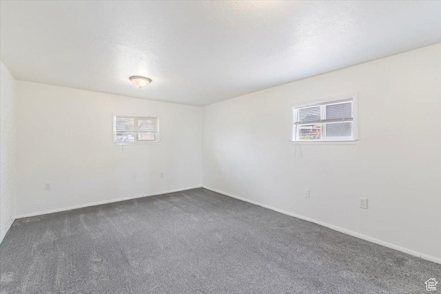 330 W 750 N, Clearfield, UT 84015 - spare room with healthy amount of natural light and dark carpet