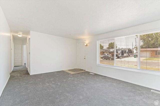 330 W 750 N, Clearfield, UT 84015 - spare room with carpet floors and a textured ceiling