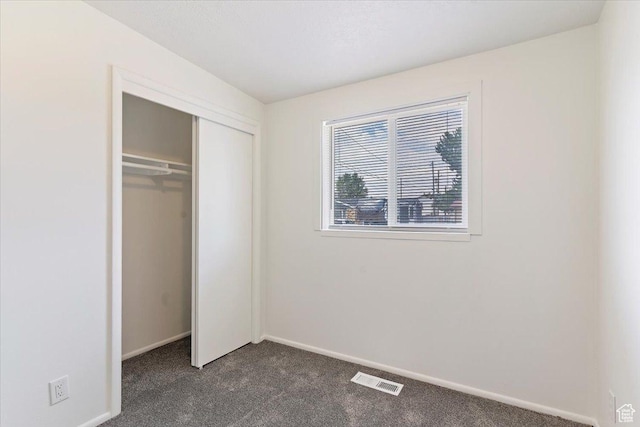 330 W 750 N, Clearfield, UT 84015 - unfurnished bedroom featuring dark carpet and a closet