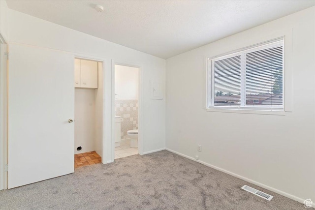 330 W 750 N, Clearfield, UT 84015 - unfurnished bedroom featuring light carpet and connected bathroom