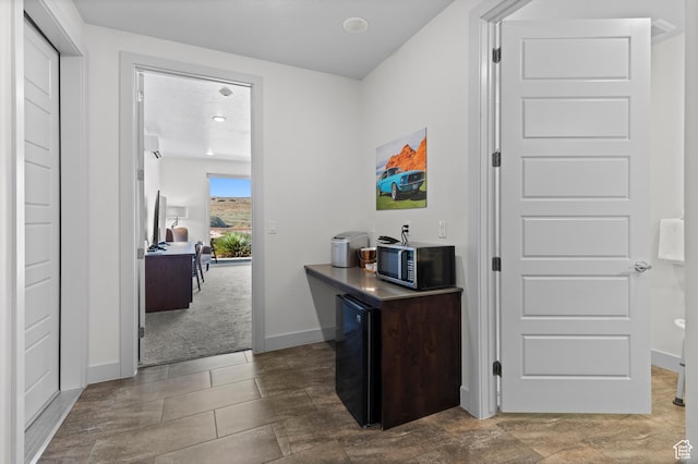 5160 W Villas N Dr N Unit 6-102, Hurricane, UT 84737 - corridor with baseboards and a desk