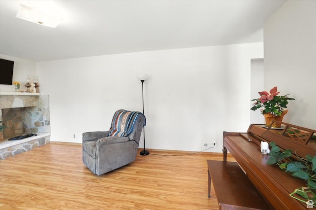 735 E 100 S, Hyrum, UT 84319 - sitting room with wood finished floors and a stone fireplace