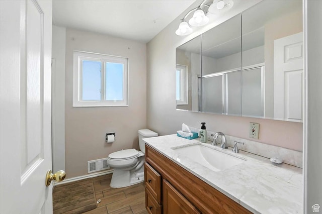 735 E 100 S, Hyrum, UT 84319 - bathroom with vanity, an enclosed shower, and wood finished floors