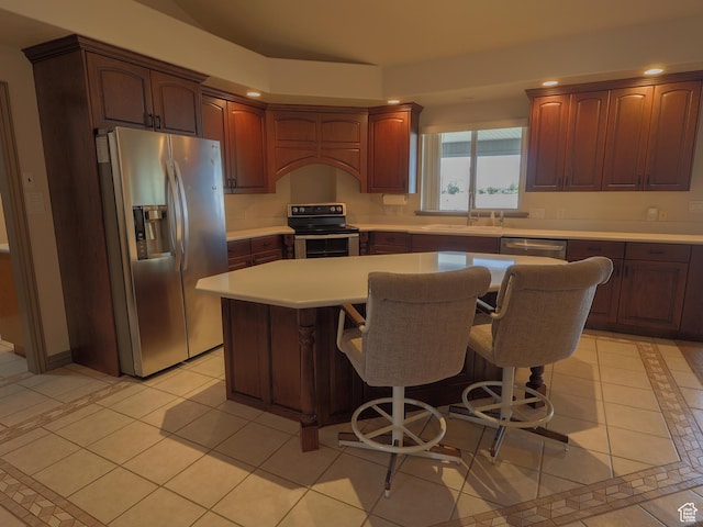 5160 W 5725 S, Hooper, UT 84315 - kitchen featuring stainless steel appliances, light countertops, recessed lighting, a center island, and a kitchen breakfast bar