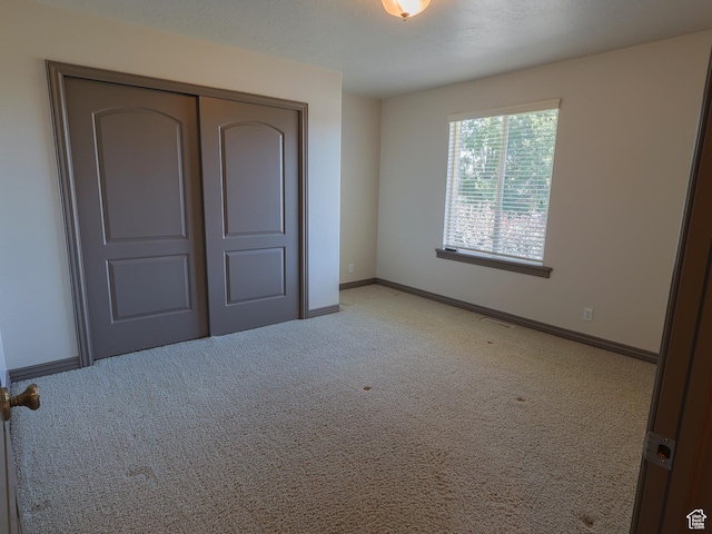 5160 W 5725 S, Hooper, UT 84315 - unfurnished bedroom with light colored carpet and a closet