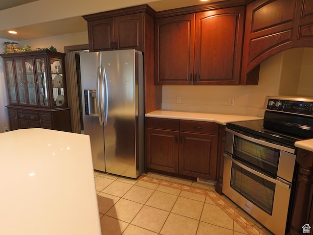 5160 W 5725 S, Hooper, UT 84315 - kitchen with stainless steel appliances, light countertops, and light tile patterned floors