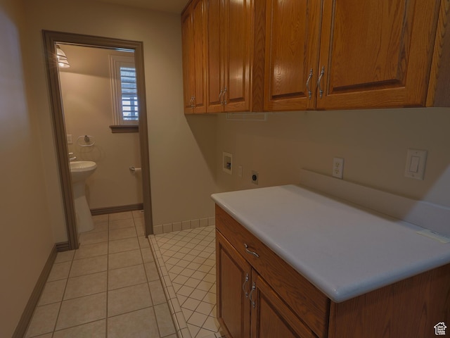 5160 W 5725 S, Hooper, UT 84315 - washroom with washer hookup, hookup for an electric dryer, light tile patterned flooring, and cabinet space