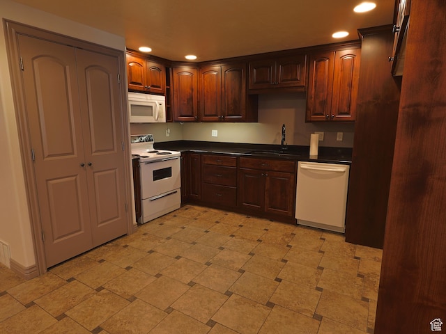 5160 W 5725 S, Hooper, UT 84315 - kitchen with white appliances, recessed lighting, dark countertops, and dark brown cabinetry