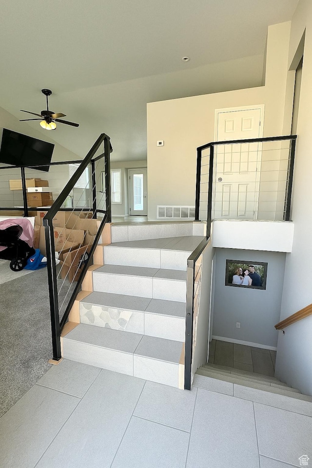 2879 S Fetzer Dr W, Magna, UT 84044 - stairs with a ceiling fan and tile patterned floors
