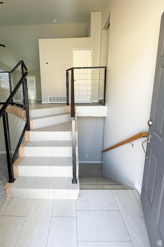2879 S Fetzer Dr W, Magna, UT 84044 - stairway featuring baseboards and tile patterned flooring