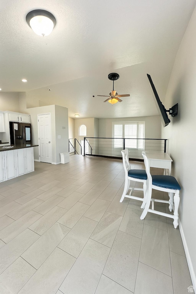 2879 S Fetzer Dr W, Magna, UT 84044 - dining space with a ceiling fan, light tile patterned floors, a textured ceiling, and recessed lighting