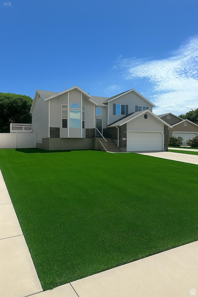 2879 S Fetzer Dr W, Magna, UT 84044 - view of front of house with driveway and a garage