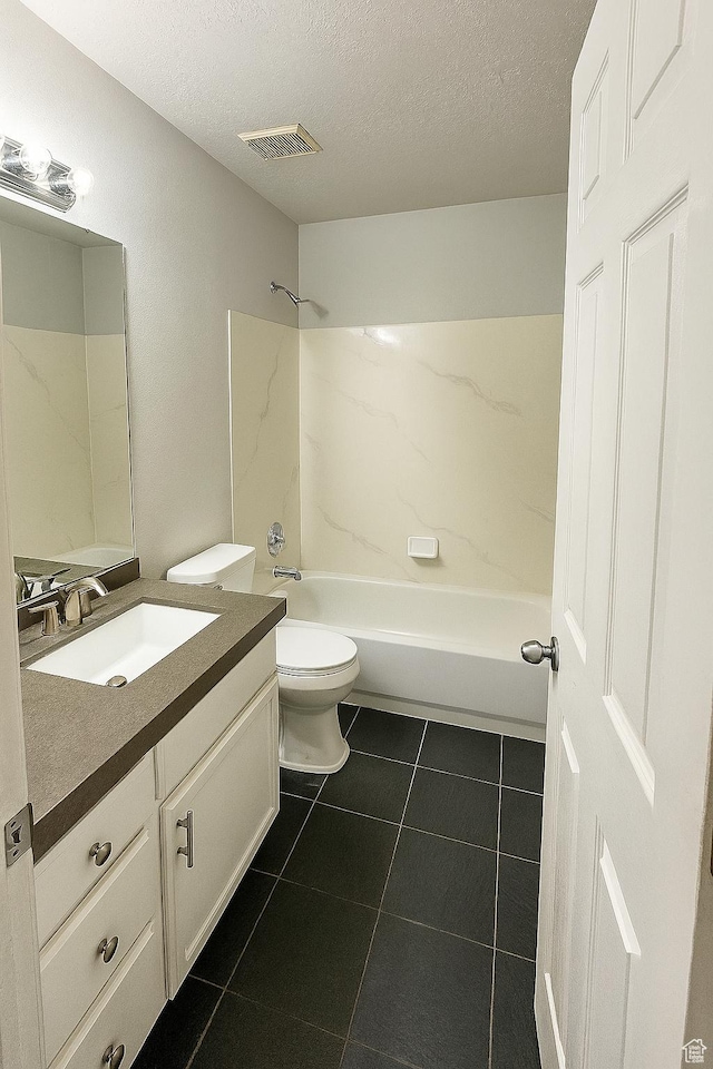 2879 S Fetzer Dr W, Magna, UT 84044 - bathroom with vanity, a textured ceiling, tile patterned flooring, and shower / washtub combination