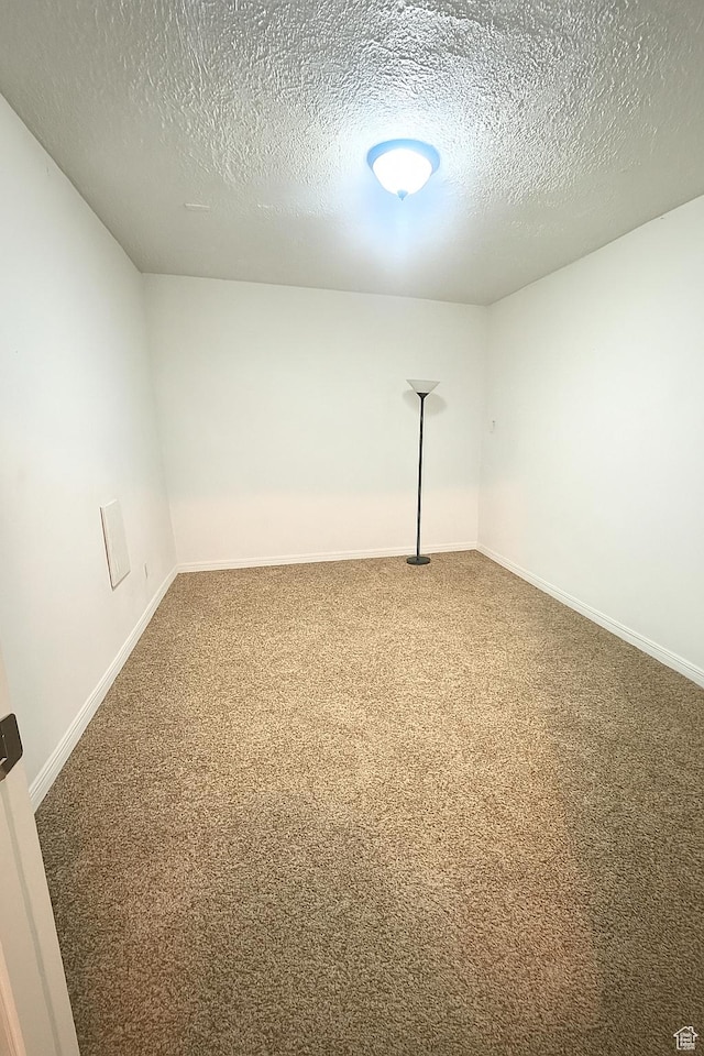2879 S Fetzer Dr W, Magna, UT 84044 - carpeted empty room featuring a textured ceiling
