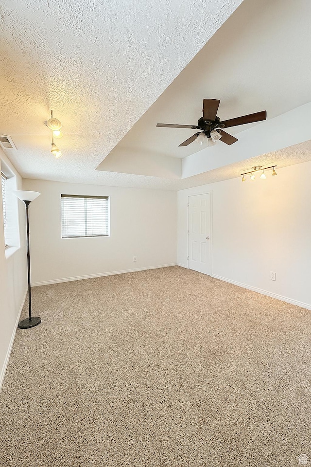 2879 S Fetzer Dr W, Magna, UT 84044 - unfurnished room featuring a ceiling fan, a textured ceiling, and carpet flooring