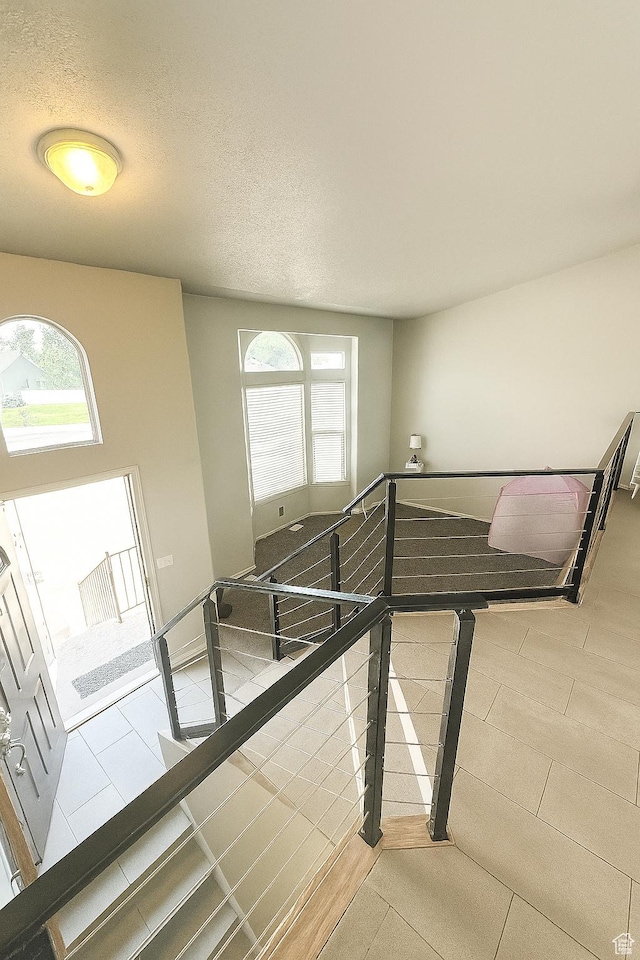 2879 S Fetzer Dr W, Magna, UT 84044 - staircase with a textured ceiling