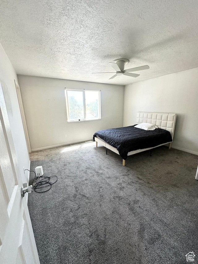 2879 S Fetzer Dr W, Magna, UT 84044 - bedroom featuring carpet, a textured ceiling, and a ceiling fan