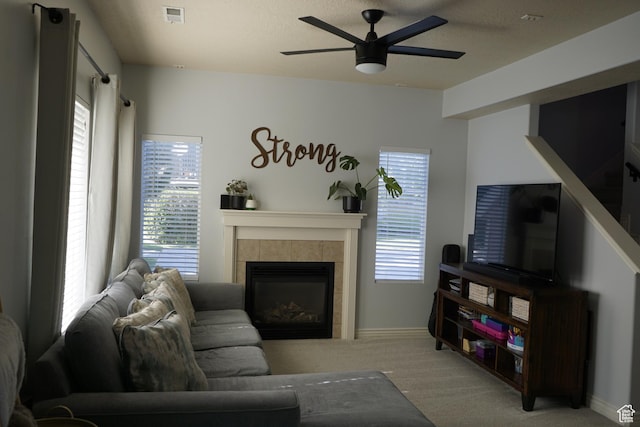 14072 S Julien Cv, Bluffdale, UT 84065 - carpeted living area with ceiling fan, a tile fireplace, and plenty of natural light