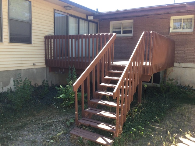30 N Main St, Aurora, UT 84620 - doorway to property featuring a wooden deck and brick siding