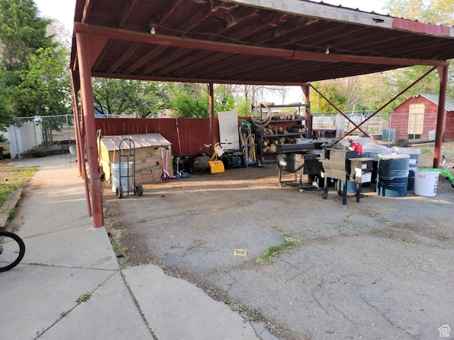 30 N Main St, Aurora, UT 84620 - view of parking / parking lot featuring a carport