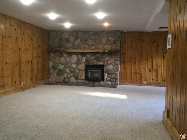 30 N Main St, Aurora, UT 84620 - unfurnished living room with wooden walls, carpet flooring, and a fireplace