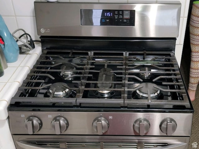30 N Main St, Aurora, UT 84620 - kitchen view of stainless steel gas range oven
