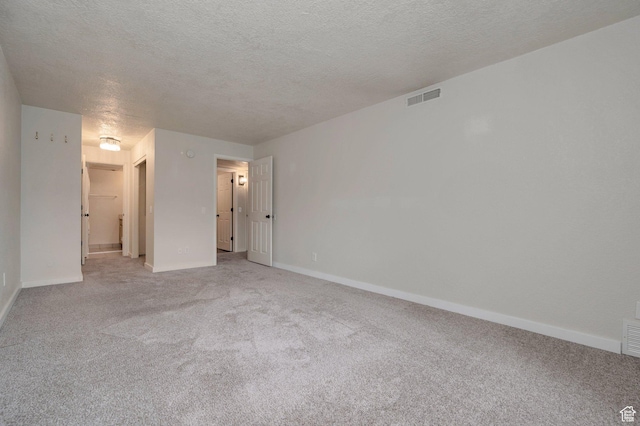 588 E Vine St S Unit 2C, Murray, UT 84107 - empty room featuring light carpet and a textured ceiling