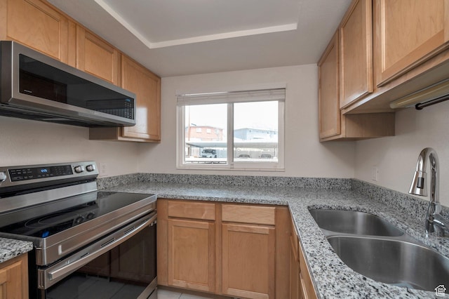 588 E Vine St S Unit 2C, Murray, UT 84107 - kitchen featuring appliances with stainless steel finishes and light stone countertops
