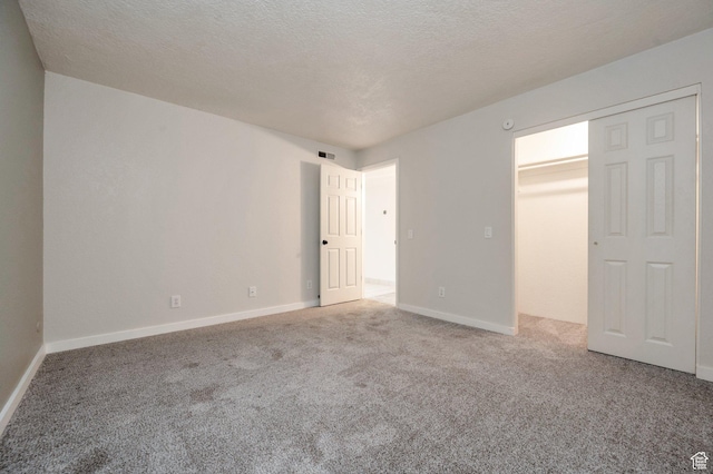 588 E Vine St S Unit 2C, Murray, UT 84107 - unfurnished bedroom with carpet and a textured ceiling