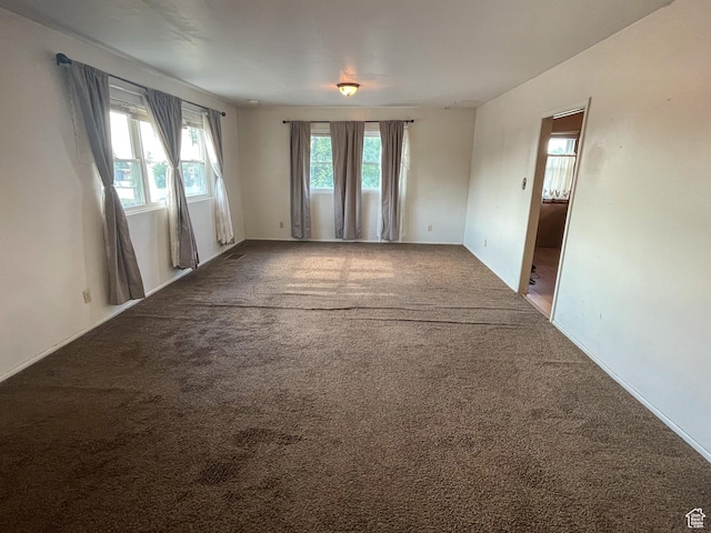 215 N Center St, Castle Dale, UT 84513 - carpeted spare room with baseboards