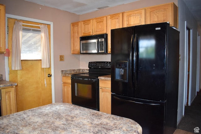 215 N Center St, Castle Dale, UT 84513 - kitchen with black appliances and light brown cabinetry