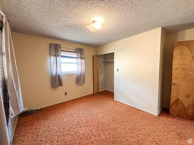215 N Center St, Castle Dale, UT 84513 - unfurnished bedroom with carpet floors, a closet, and a textured ceiling