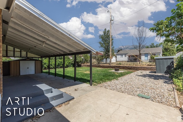 4746 S 250 W, Washington Terrace, UT 84405 - view of patio / terrace featuring a storage unit and an attached carport