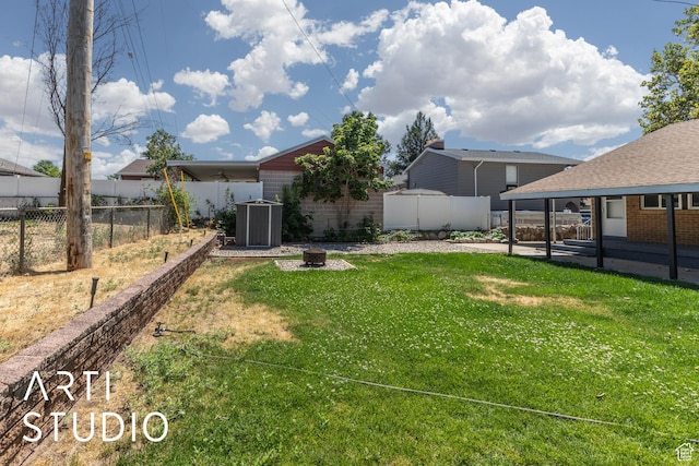 4746 S 250 W, Washington Terrace, UT 84405 - fenced backyard featuring a patio area and a fire pit