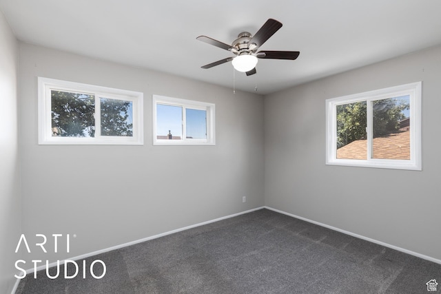 4746 S 250 W, Washington Terrace, UT 84405 - spare room featuring plenty of natural light, dark carpet, and a ceiling fan