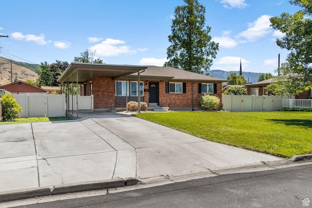 1500 N 350 W, Bountiful, UT 84010 - single story home with a gate, a mountain view, brick siding, driveway, and a carport