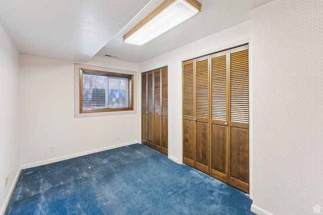 784 E 2150 S, Bountiful, UT 84010 - unfurnished bedroom featuring multiple closets and dark carpet