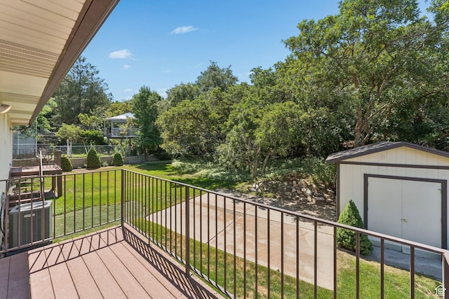 784 E 2150 S, Bountiful, UT 84010 - wooden deck featuring a storage unit, a yard, and view of scattered trees