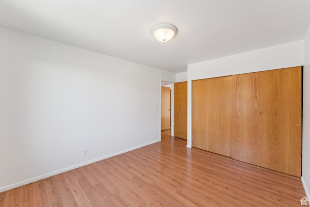 784 E 2150 S, Bountiful, UT 84010 - unfurnished bedroom with light wood-style floors and a closet