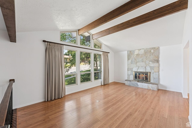 784 E 2150 S, Bountiful, UT 84010 - unfurnished living room featuring wood-type flooring, a fireplace, and a textured ceiling